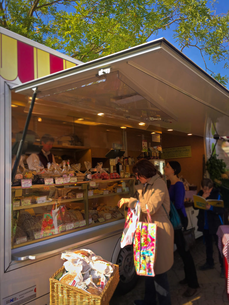 Customers buying bread and sweets at the stadfest in Wiesbaden Germany