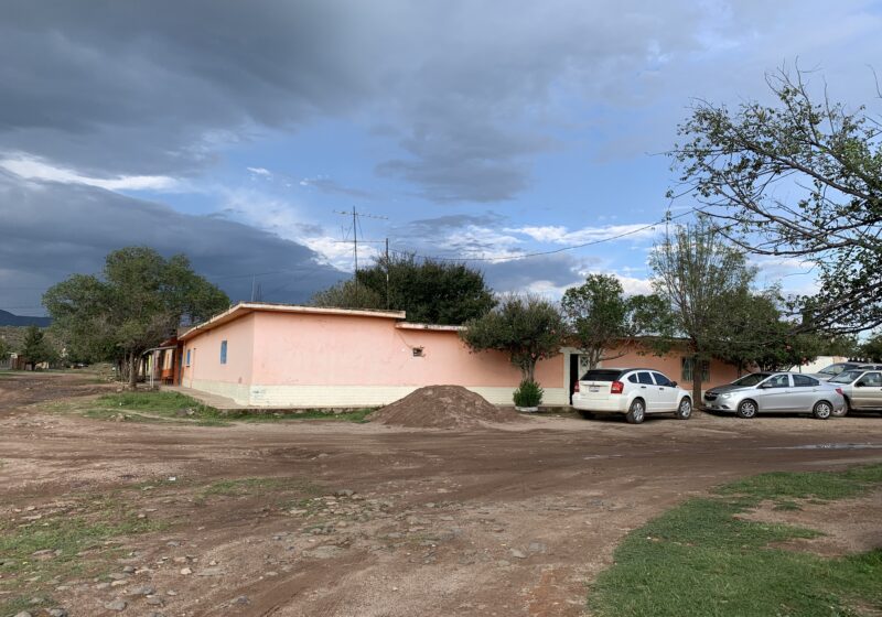 A pink adobe house in a Mexican rancho